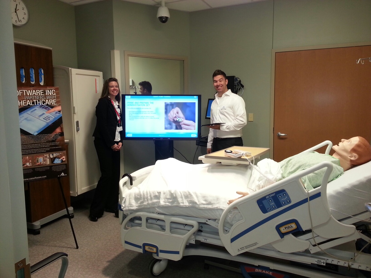 Nick Striegel, Multimedia Developer at CSE Software Inc. and nurse scholar Cassandra Kurtz demonstrate the new Smart Pump app developed by CSE.